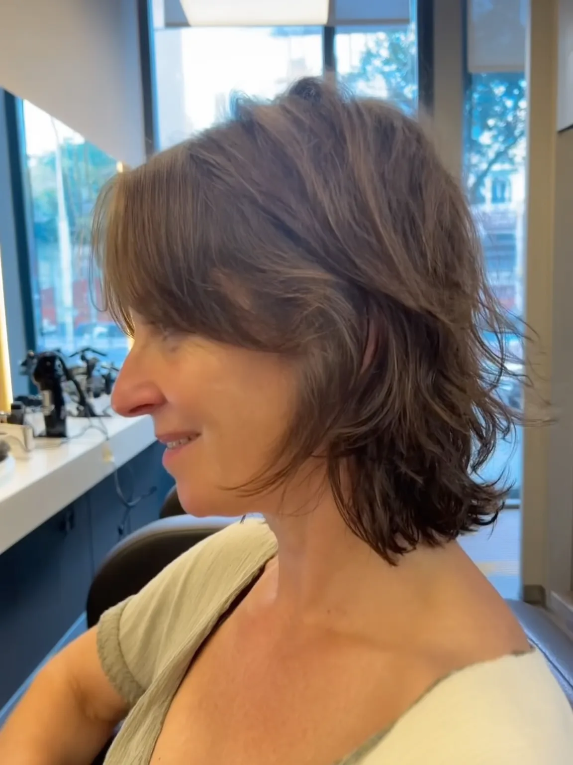 Medium Wavy Layered Bob with Side-Swept Bangs